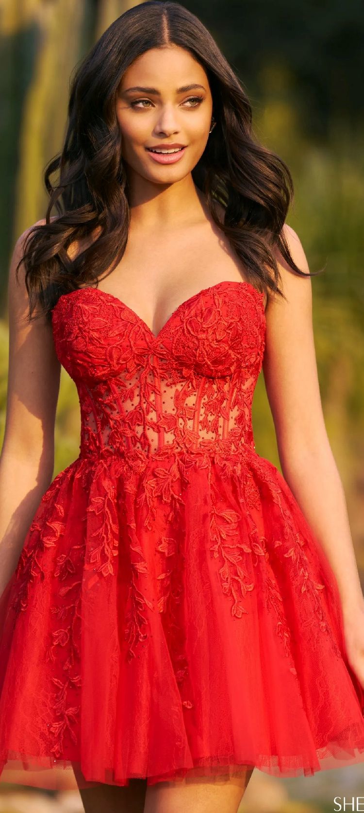 Model in red Homecoming Sherri Hill dress