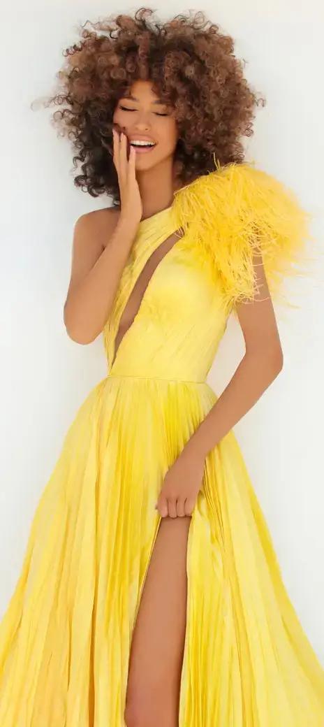 Model in yellow Tarik Ediz dresses